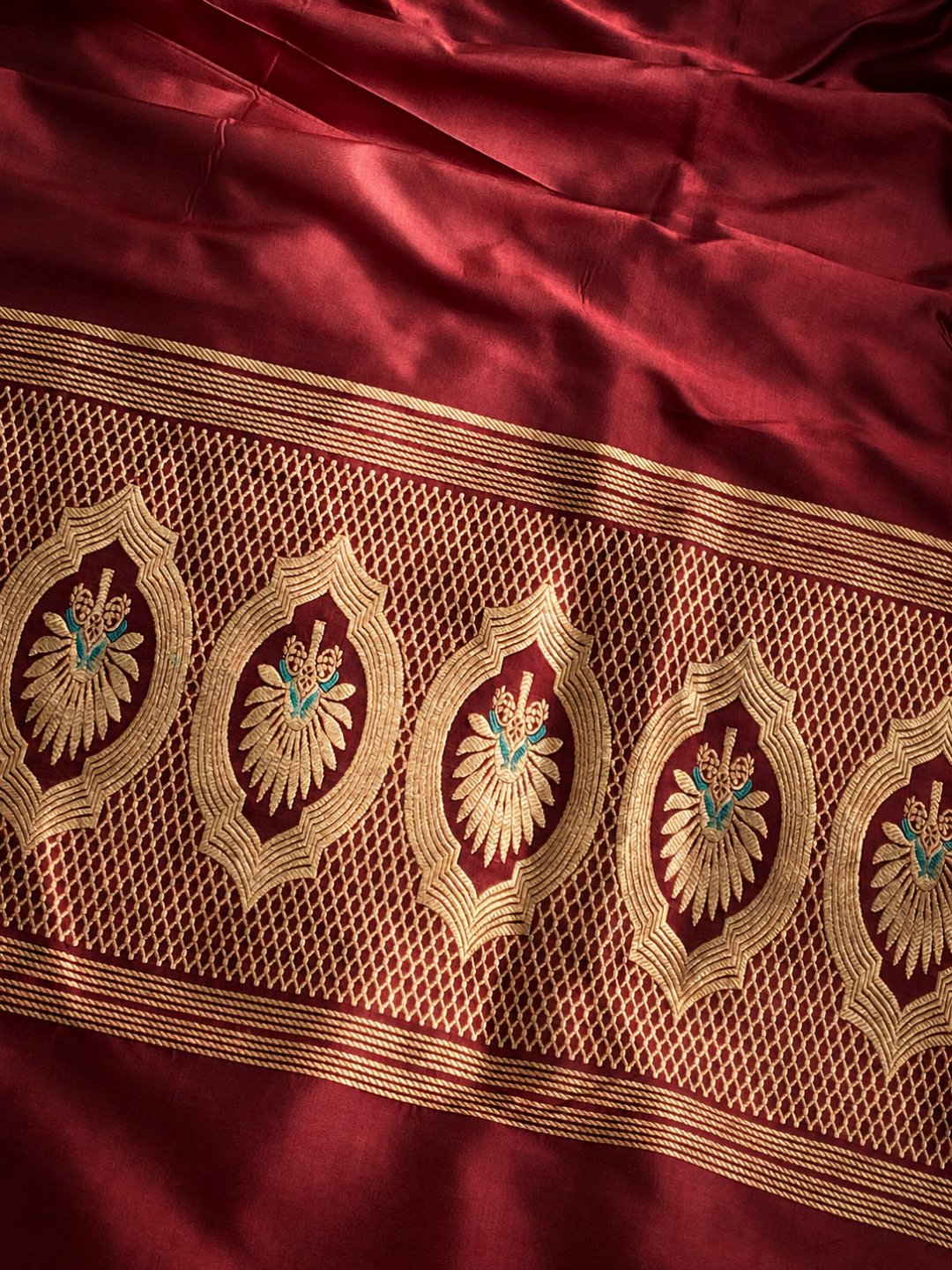 Burgundy with gold and small turquoise details Katan Silk Banarasi suit dupatta detail