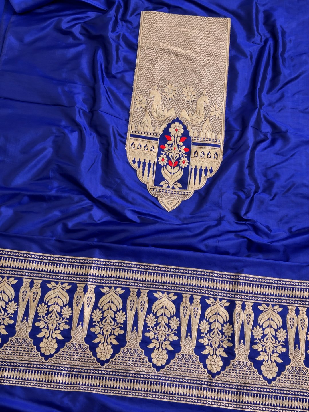 Royal blue with gold detailing and small red accents Katan Silk Banarasi suit bottom detail