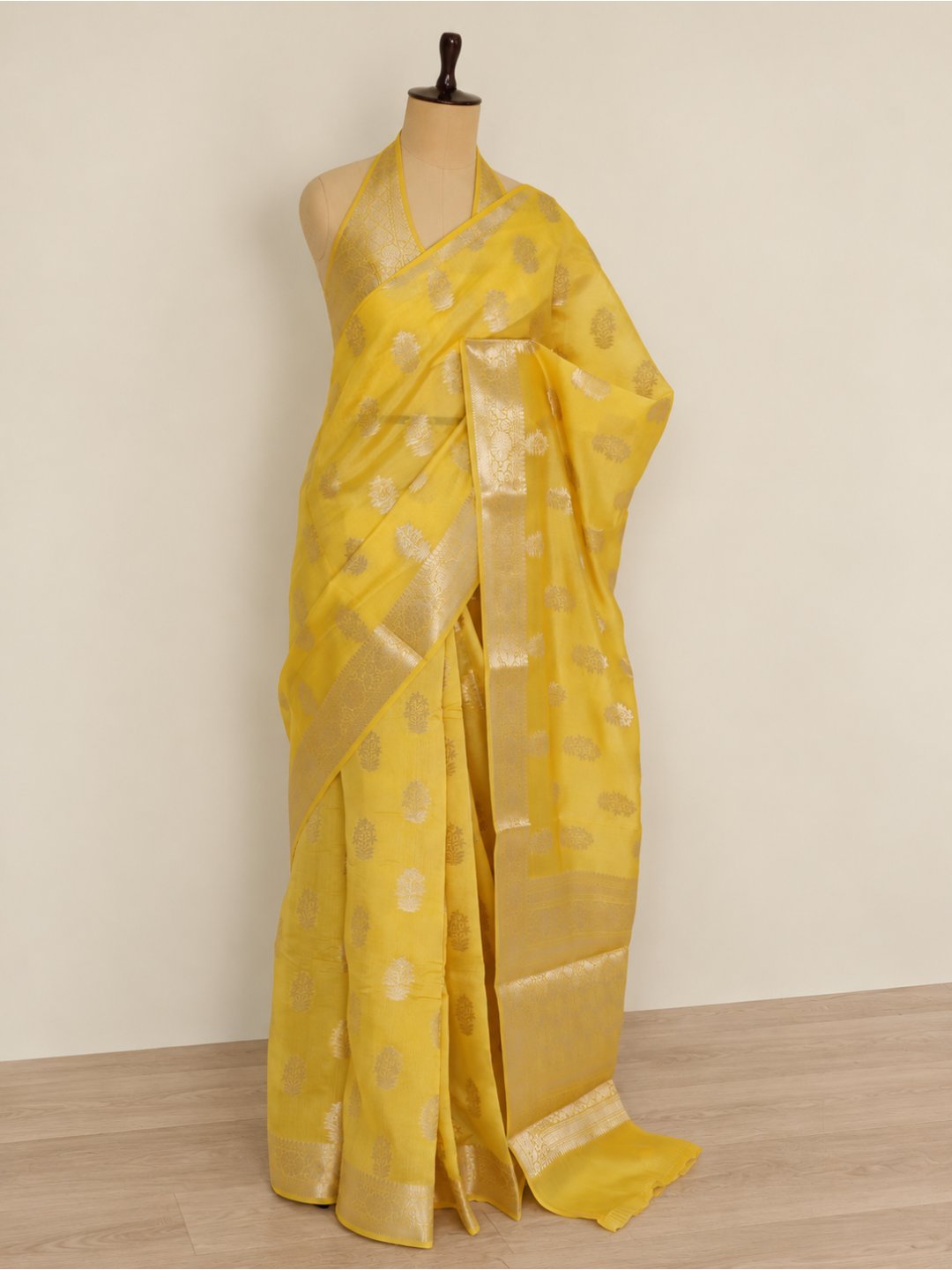 Bright lemon yellow with light gold-toned detailing Viscose saree Banarasi saree border closeup