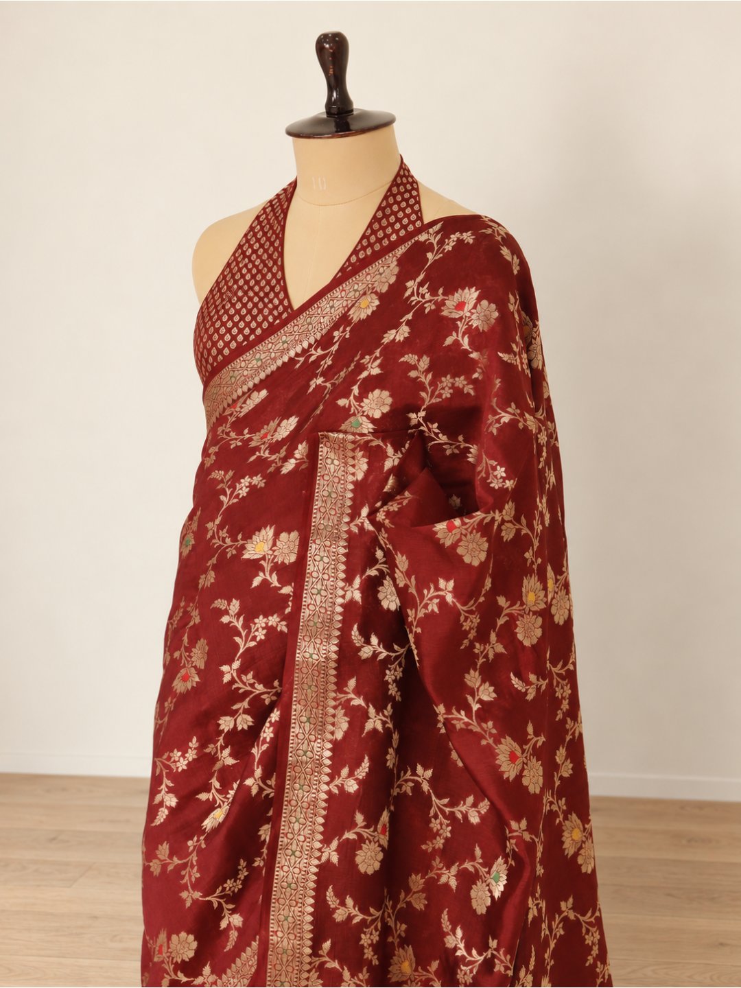 Deep maroon with gold-toned detailing Viscose Banarasi saree front drape view