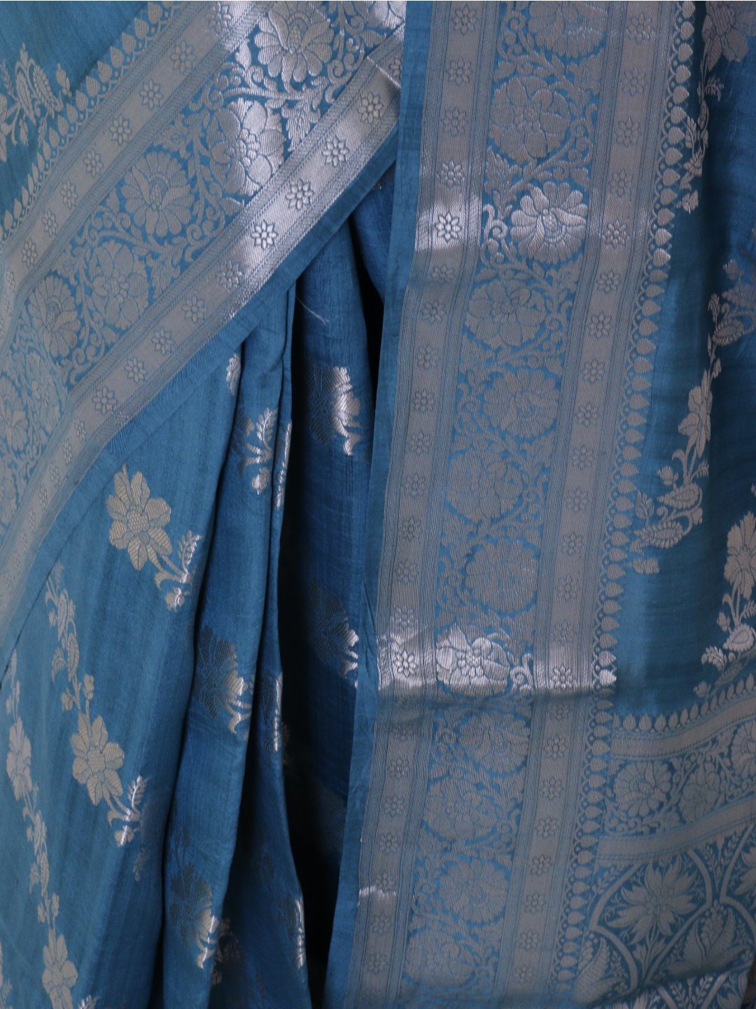Teal blue with silver-toned detailing Chiniya Silk Banarasi saree texture detail