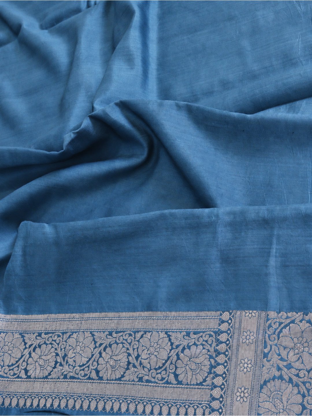Teal blue with silver-toned detailing Chiniya Silk Banarasi saree folded view