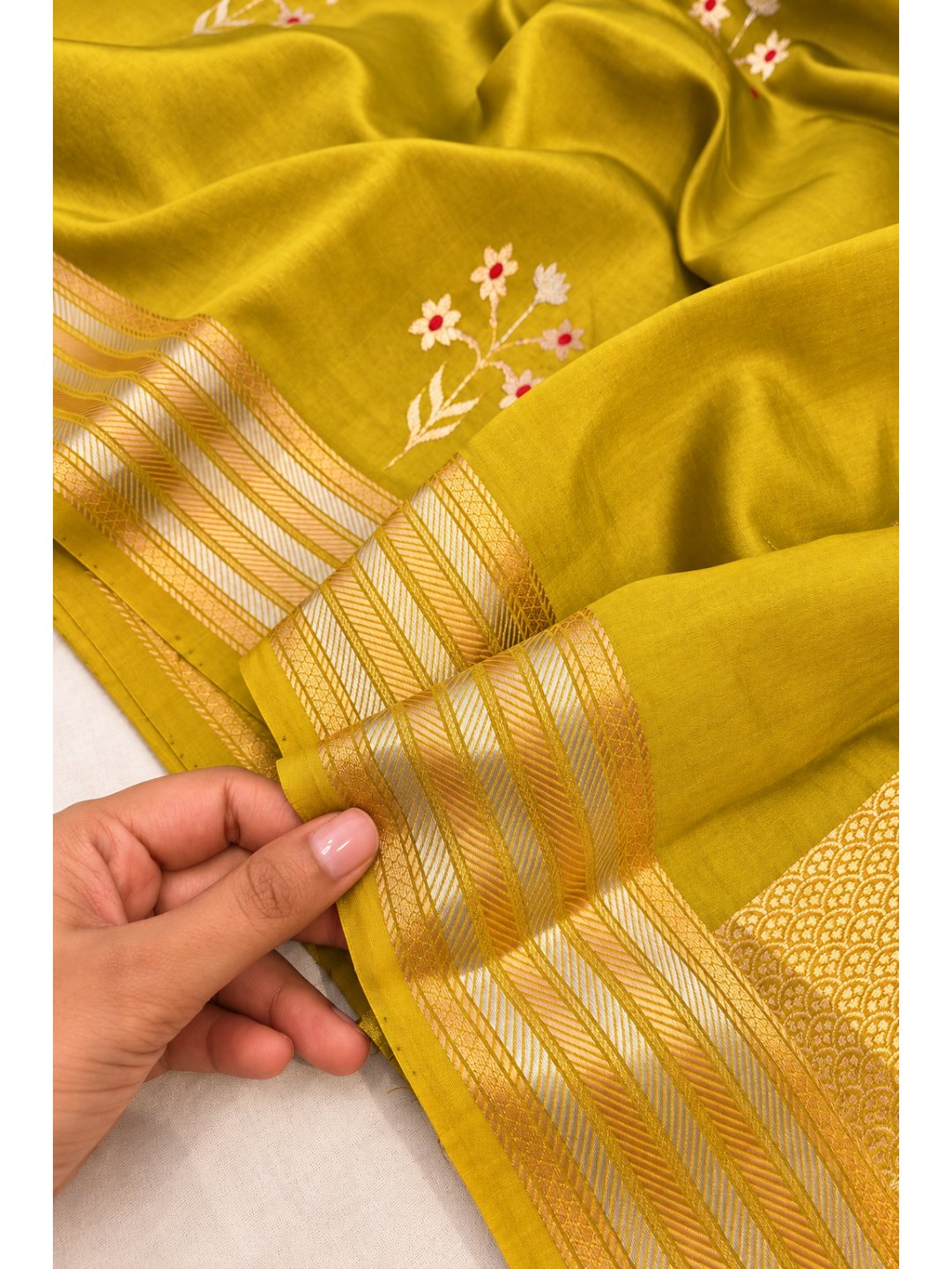 Mehandi Green Katan Silk Banarasi saree border closeup