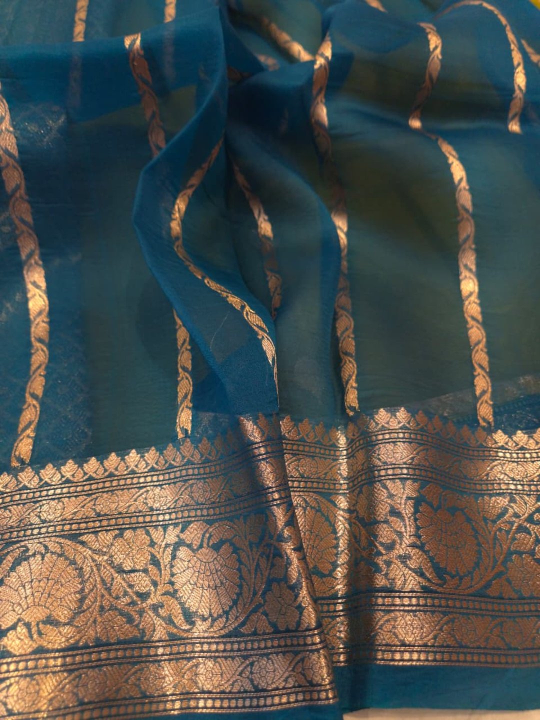 Olive green body with peacock blue border Kora Silk Banarasi saree folded view