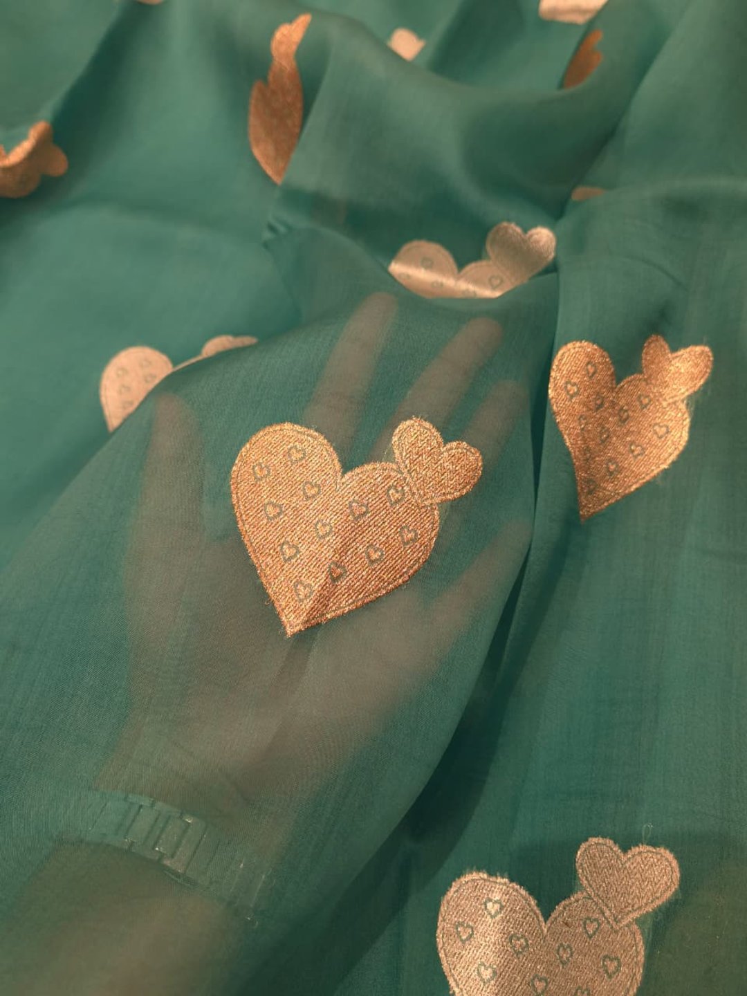 Teal blue Kora Silk Banarasi saree border closeup