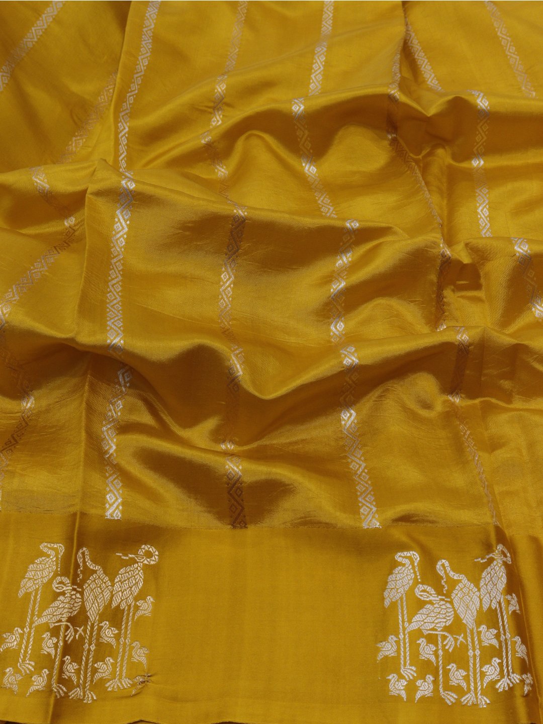 Yellow with gold and silver-toned zari Katan Silk Banarasi saree texture detail