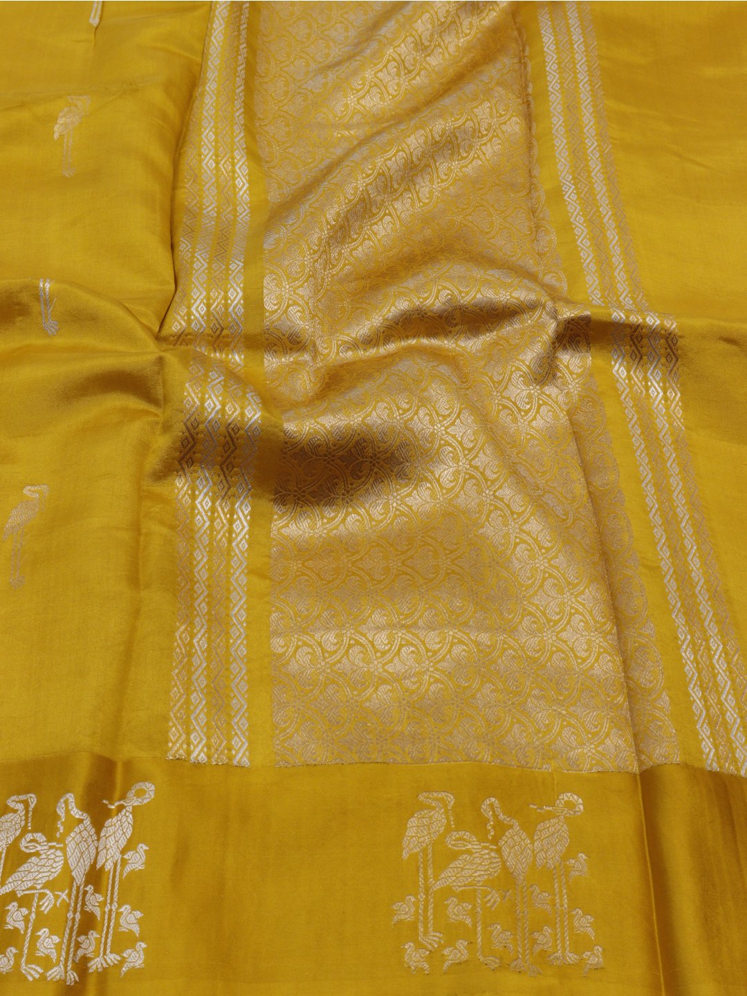 Yellow with gold and silver-toned zari Katan Silk Banarasi saree pallu detail