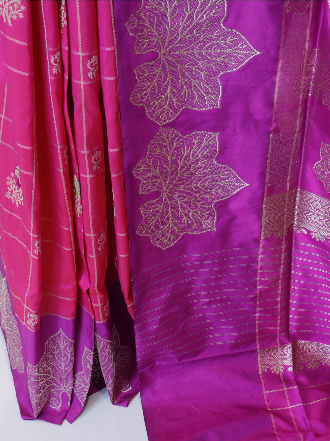 Rani pink with a contrasting purple border and pallu. Katan Silk Banarasi saree blouse piece