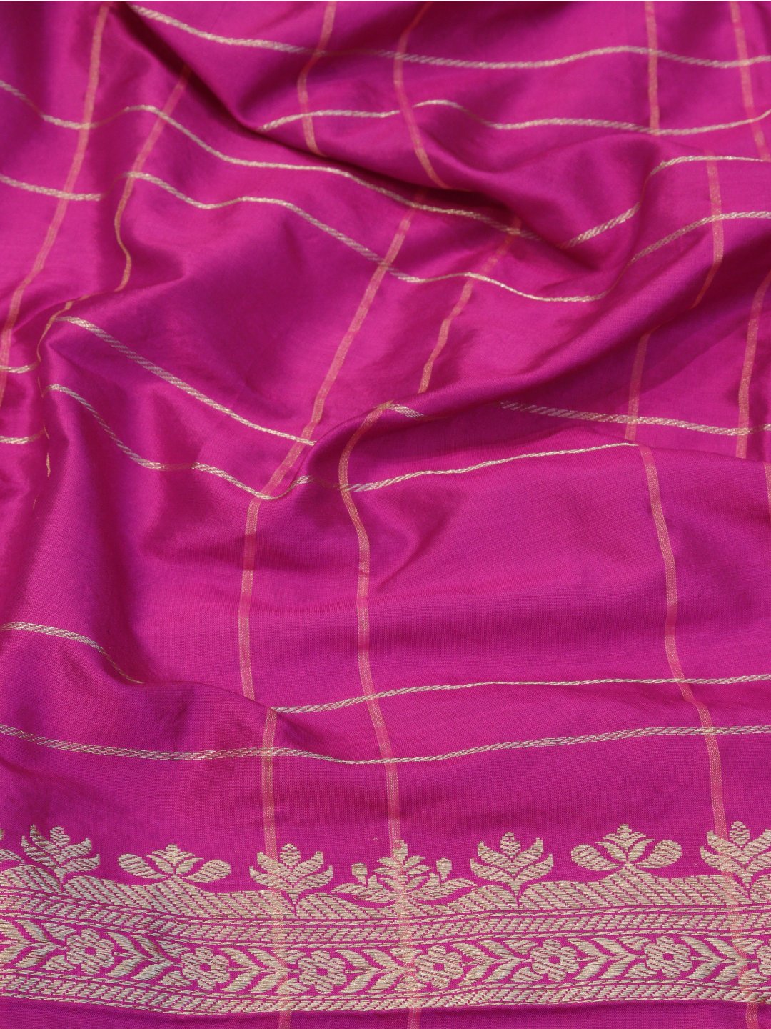 Rani pink with a contrasting purple border and pallu. Katan Silk Banarasi saree zari work detail