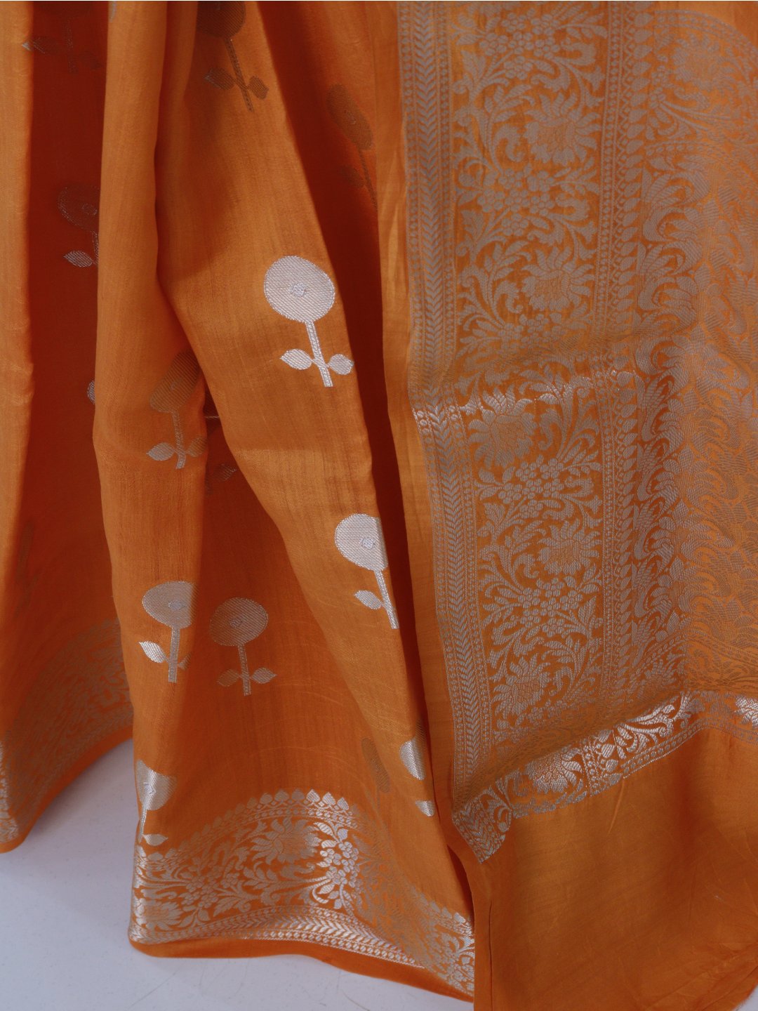 Orange with silver-toned zari detailing Chiniya Silk Banarasi saree front drape view