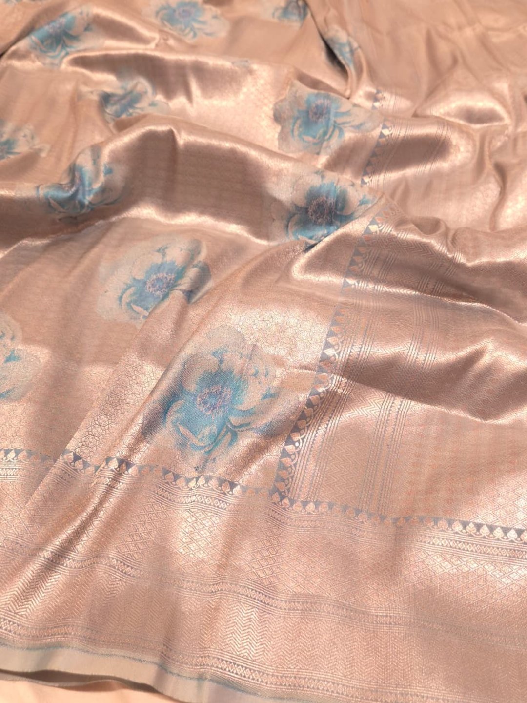 Silver body with sky blue floral motifs Mulbari silk Banarasi saree front drape view