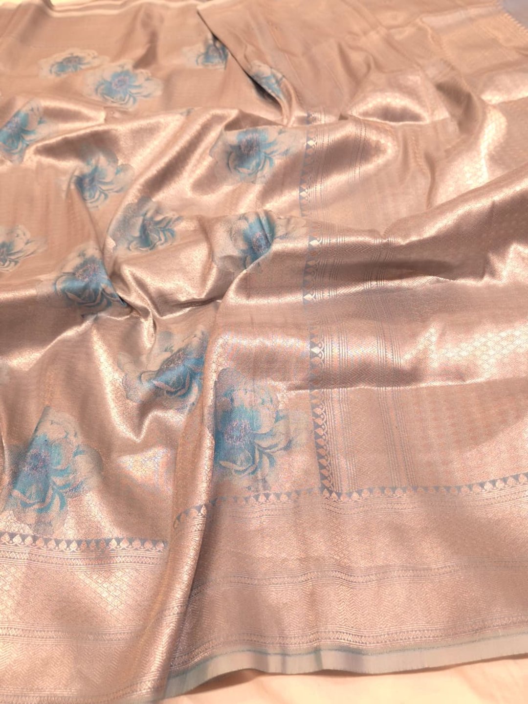 Silver body with sky blue floral motifs Mulbari silk Banarasi saree pallu detail