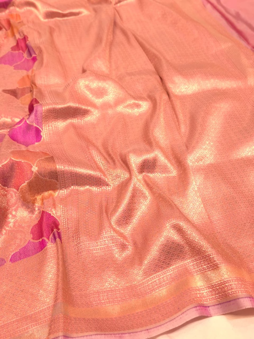 A soft peach and rose-gold base with pink, purple, orange and muted brown accents Mulbari silk Banarasi saree full spread