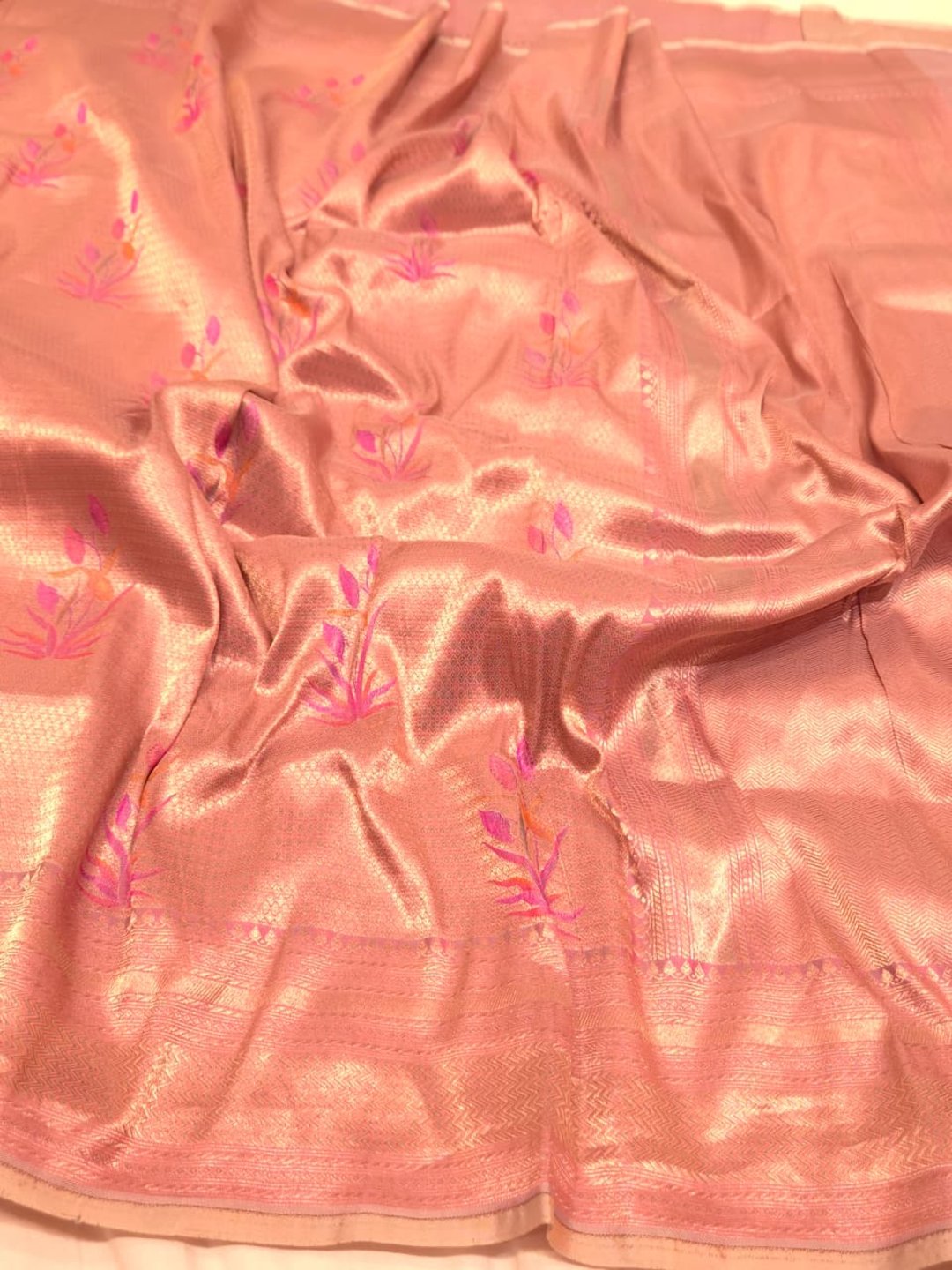 A soft peach and rose-gold base with pink, purple, orange accents Mulbari silk Banarasi saree front drape view