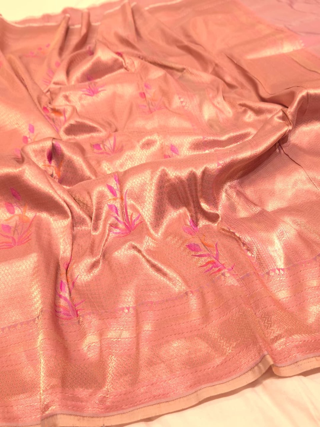 A soft peach and rose-gold base with pink, purple, orange accents Mulbari silk Banarasi saree pallu detail