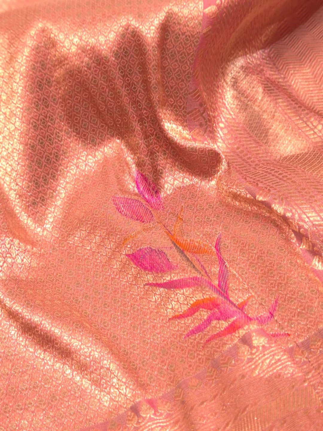 A soft peach and rose-gold base with pink, purple, orange accents Mulbari silk Banarasi saree full spread