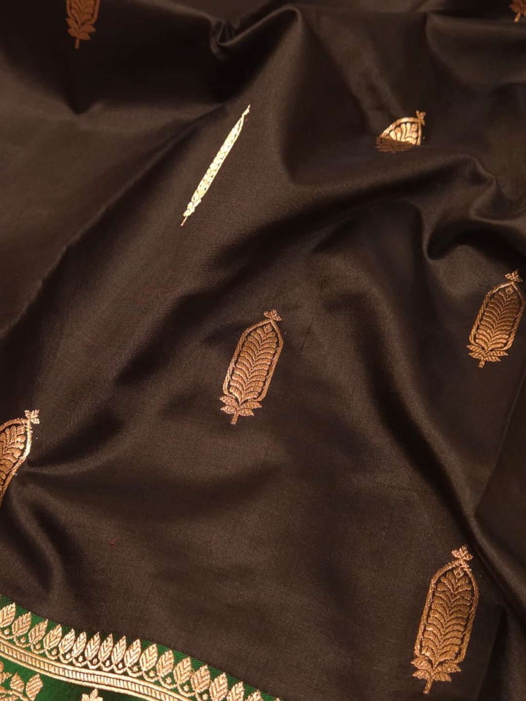 Black with green contrast border Katan Silk Banarasi saree border closeup