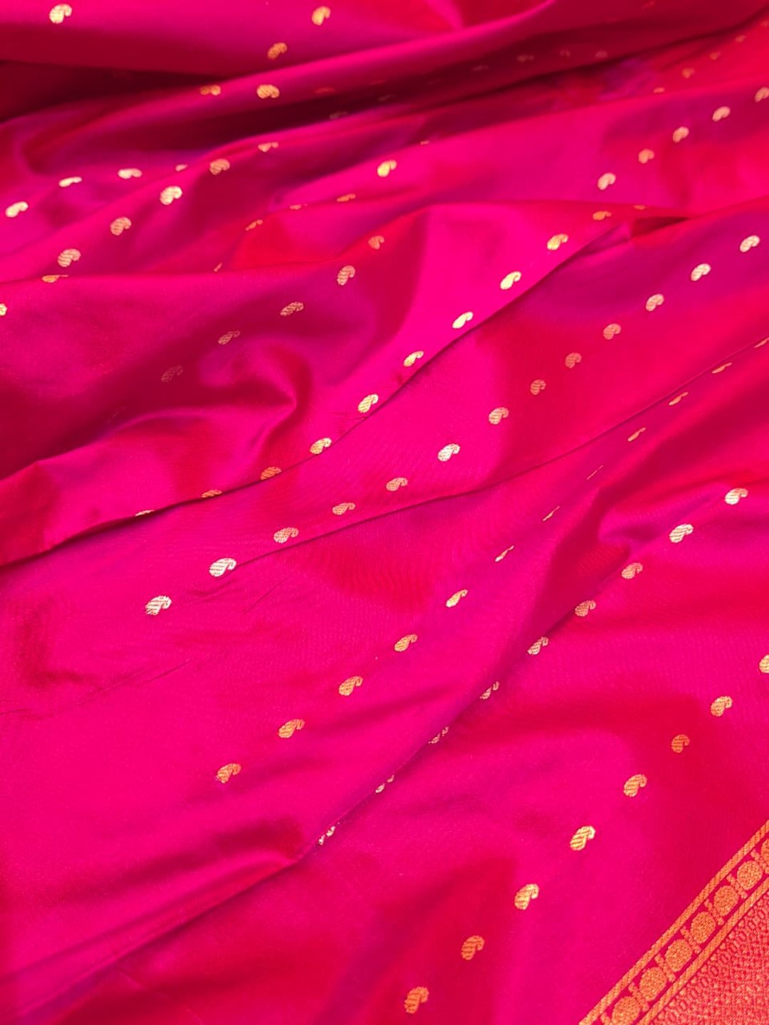 Rani Pink with gold-toned weaving Katan Silk Banarasi saree texture detail