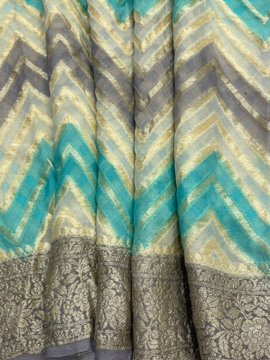 Off white tone with multicolor strips Chiffon Banarasi saree border closeup