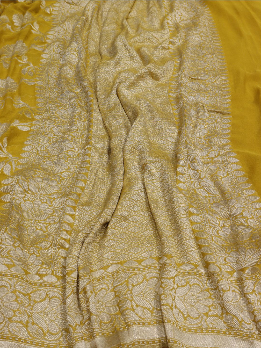 Musturd yellow silver zari jaal work Georgette Banarasi saree border closeup