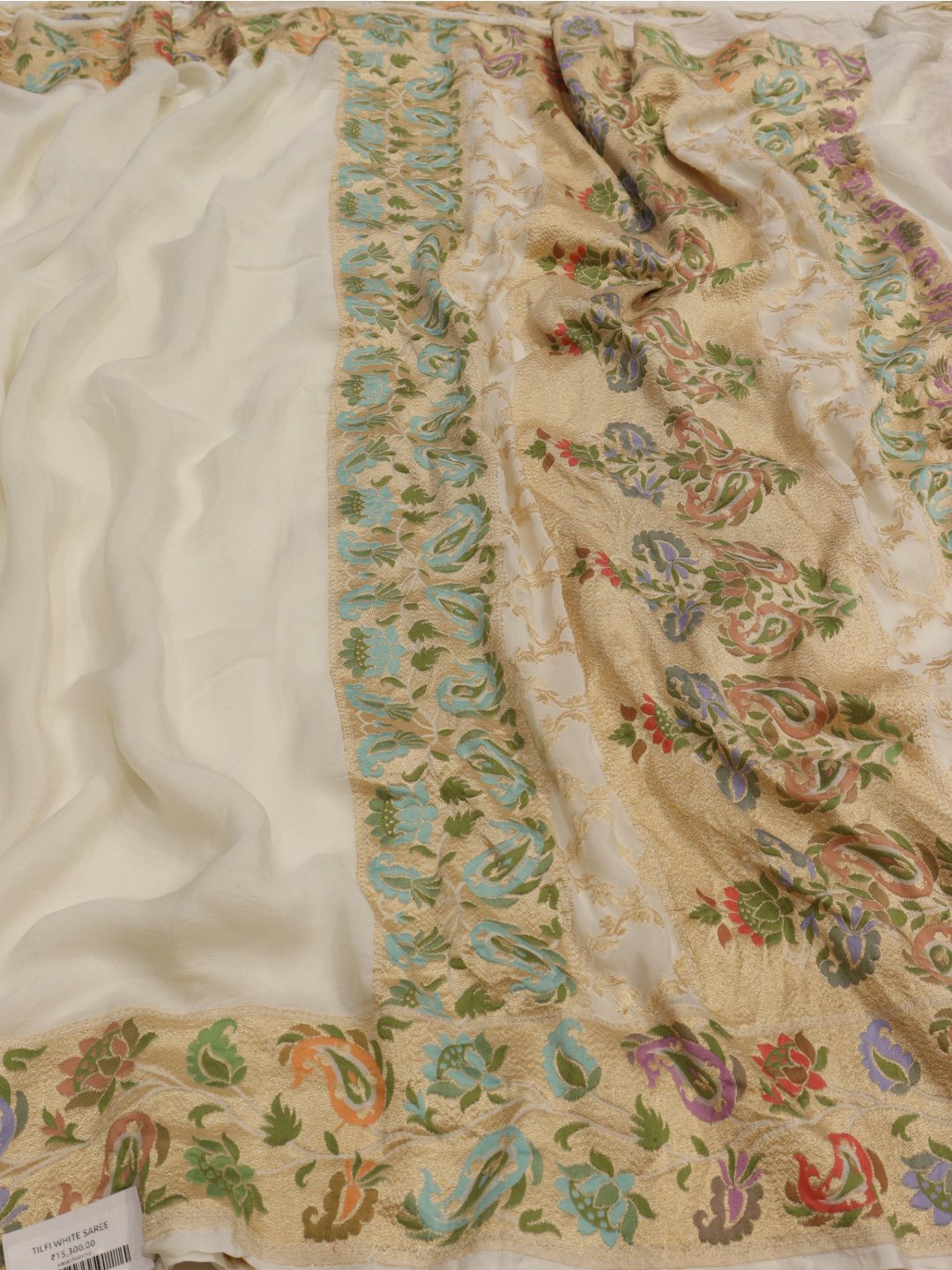 white with multicolor floral jaal work Georgette Banarasi saree front drape view