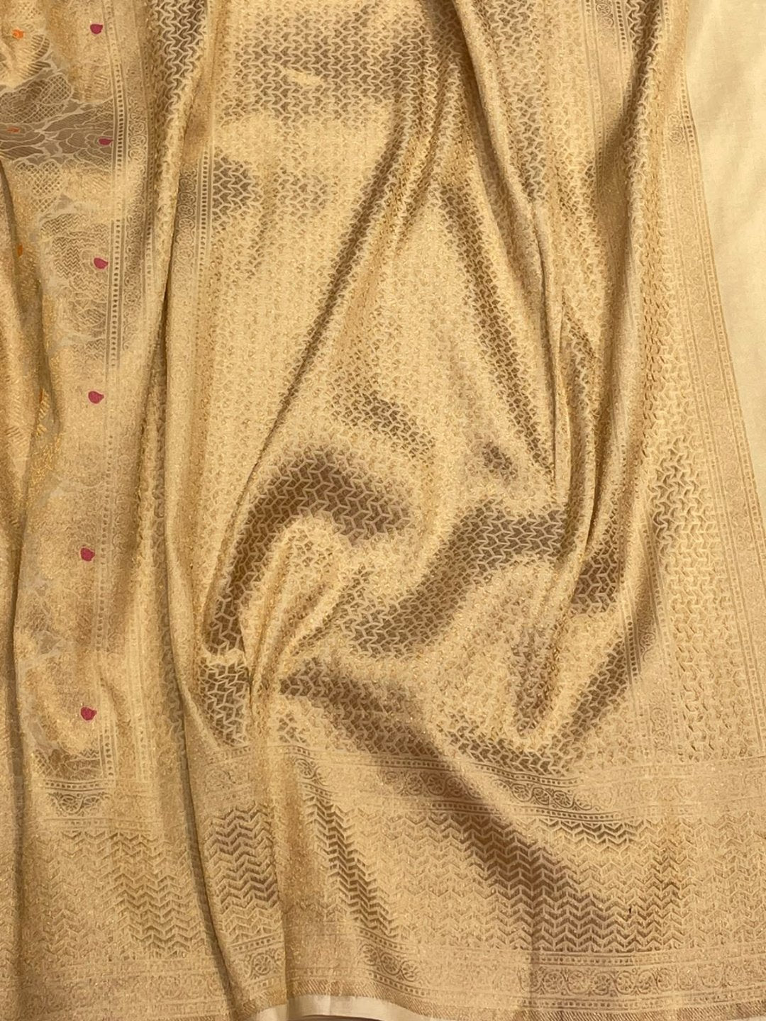 Ivory with Orange and Pink buta Katan Silk Banarasi saree border closeup