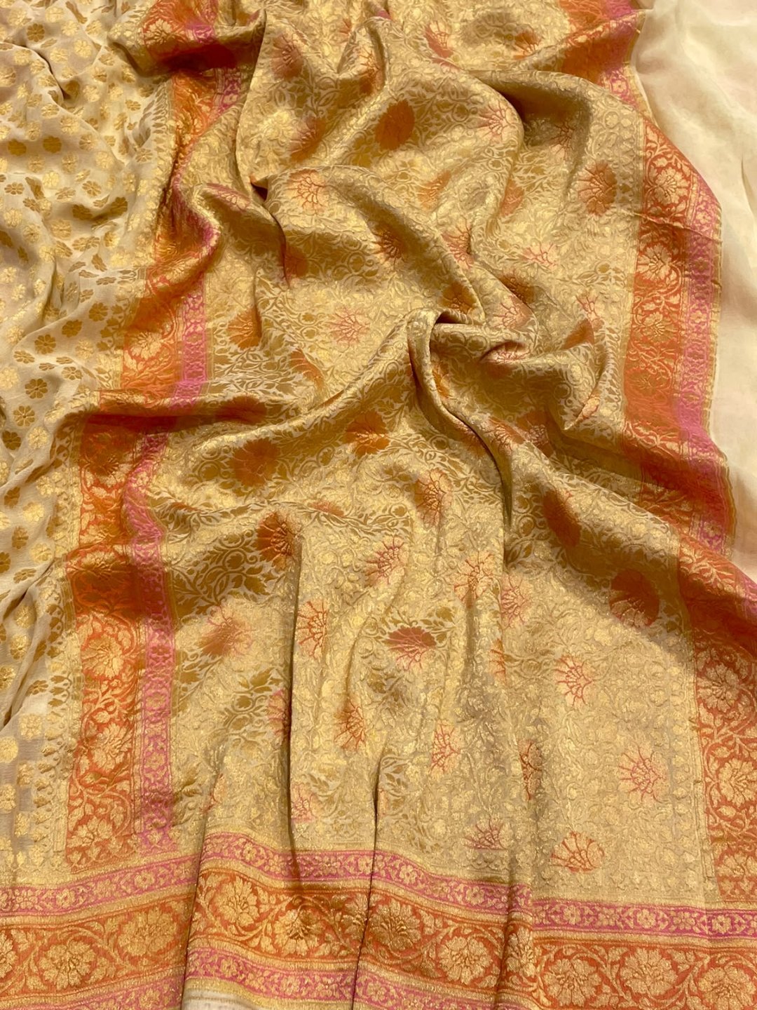 Off white with pink and peach shade Chiffon Banarasi saree front drape view