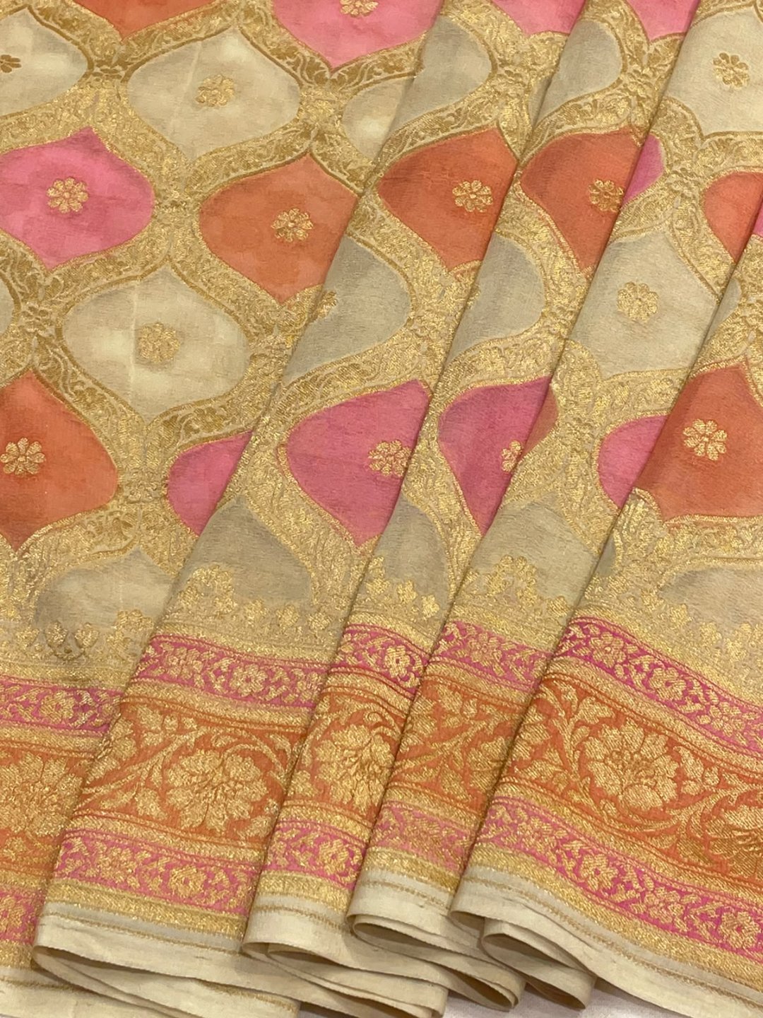 Off white with pink and peach shade Chiffon Banarasi saree border closeup