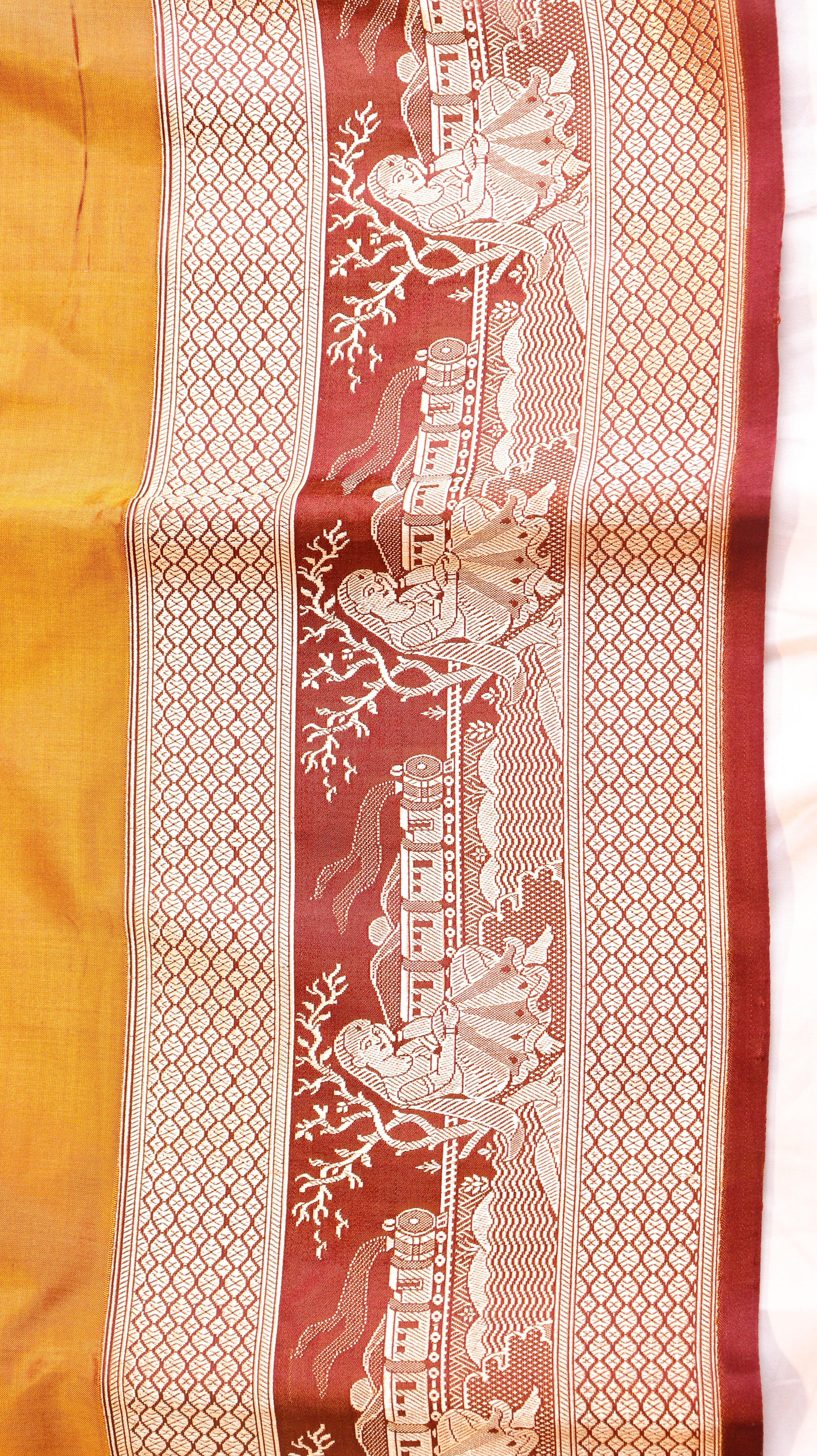 Gold Mustard Pure Katan Silk Handloom Saree with Graceful Sitting Women showing Calm in Border