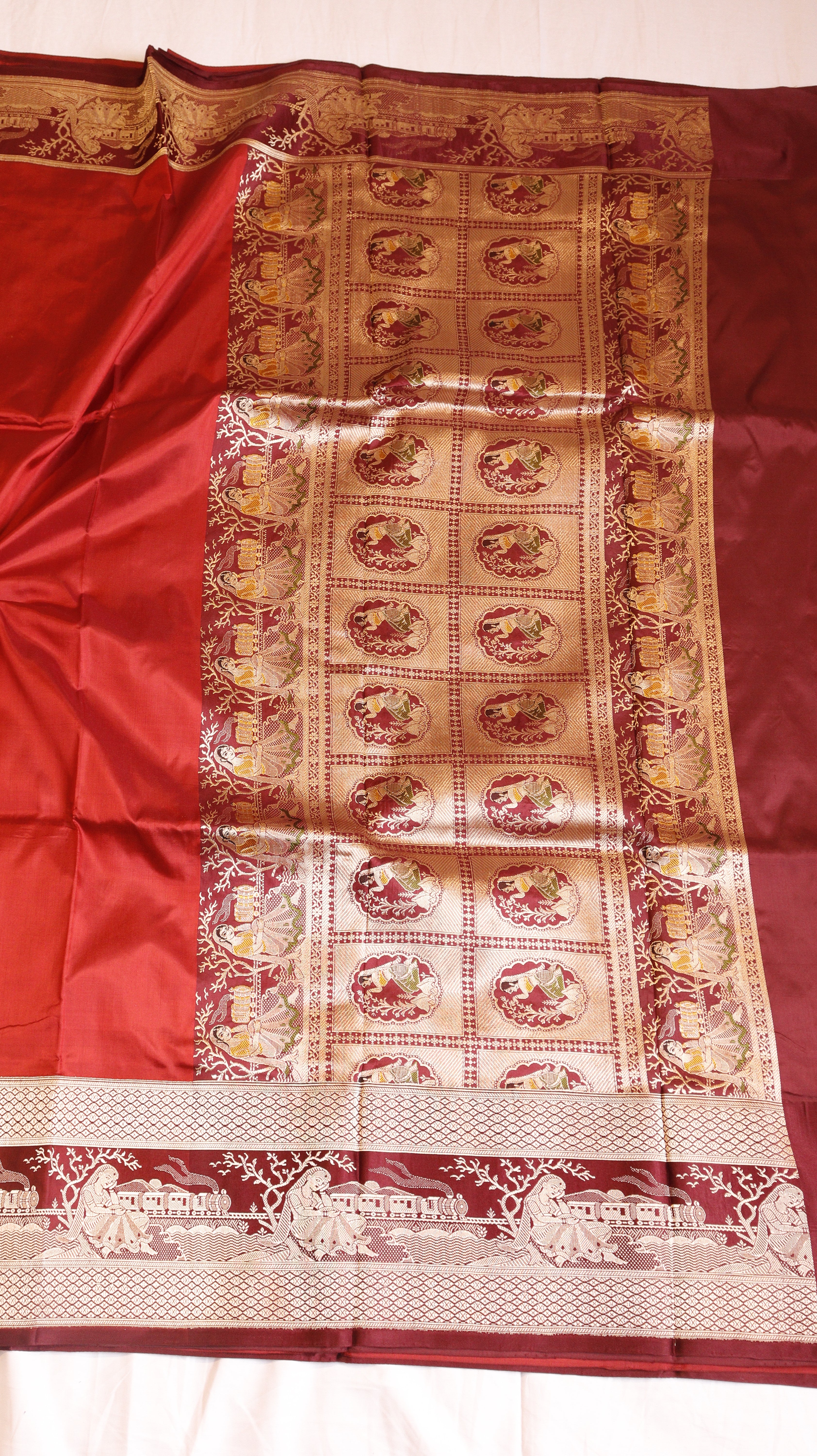 Red Pure Katan Silk Handloom Saree with Graceful Sitting Women showing Calm in Border